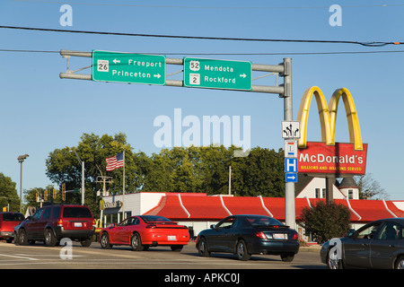 ILLINOIS Dixon Lincoln Highway sign McDonalds restaurant and traffic highway intersection information signs vehicles on road Stock Photo