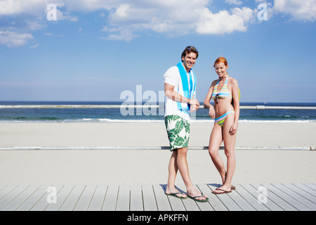 Young couple by railings at beach (portrait), Spring Lake, New Jersey, USA Stock Photo