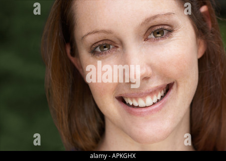 Young woman smiling (portrait) Stock Photo