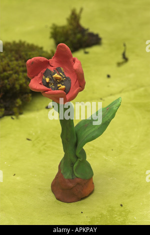 kids tinker flowers of modeling clay Stock Photo
