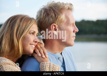 Couple looking into distance Stock Photo