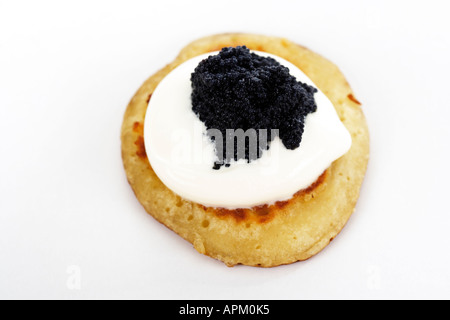 Blini with sour cream snd caviar Stock Photo