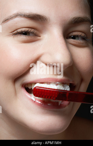 Woman brushing teeth, close-up Stock Photo