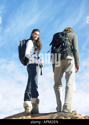 Young couple hiking, low angle view Stock Photo