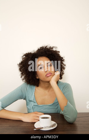 Young woman with cup of coffee Stock Photo