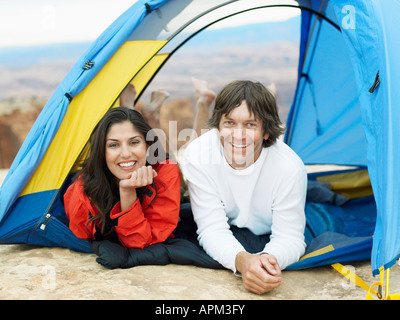 Couple lying in tent, portrait Stock Photo