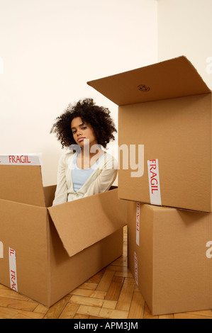 Young woman inside a cardbox Stock Photo
