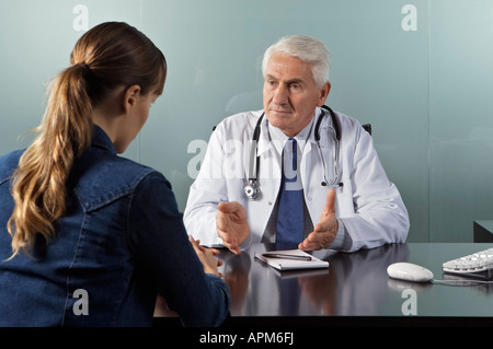 Doctor with patient at office Stock Photo