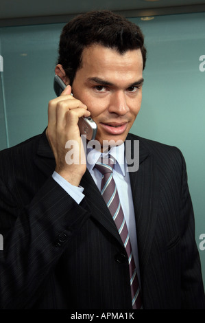 Businessman using his cellular phone Stock Photo