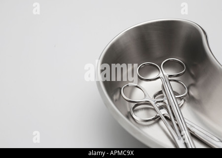 Medical scissors in kidney dish Stock Photo