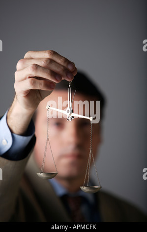 Man holding a balance Stock Photo