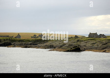 Abandoned cottages on the uninhabited island of Swona Pentland Firth Orkney Scotland UK