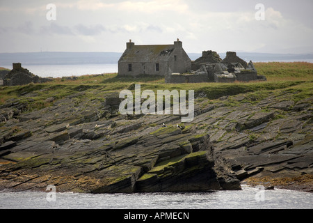 Abandoned cottages on the uninhabited island of Swona Pentland Firth Orkney Scotland UK