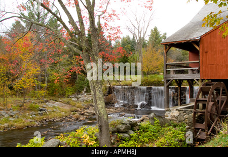 Historical Old grist Mill with waterfall on river in village of Weston Vermont Stock Photo