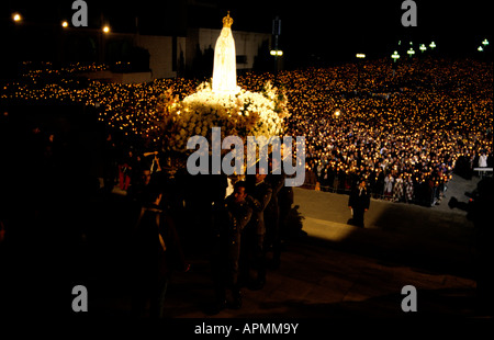 The statue of Our Lady of Fátima is carried to the sanctuary of Fátima during the annual pilgrimage to the holy shrine Stock Photo