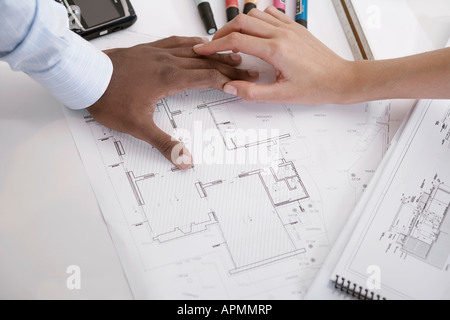 Two architects with blueprints (focus on hands) Stock Photo