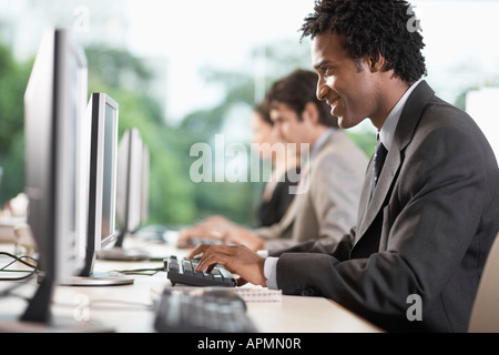 Office workers using computers Stock Photo
