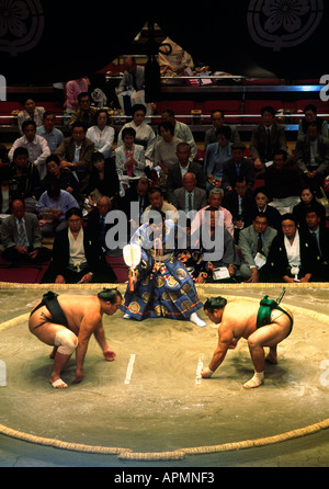 Two sumo wrestlers face each other before a wrestling bout in Ryogoku stadium during the autumn Presidents Cup Sumo Tournament. Stock Photo