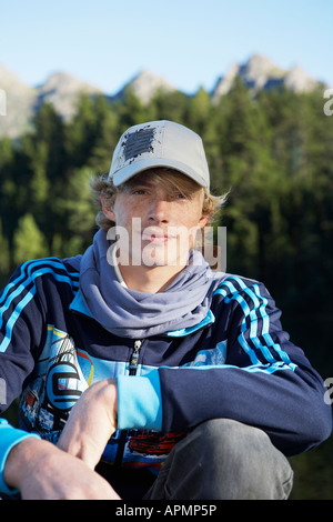 Teenage boy wearing baseball cap (portrait) Stock Photo