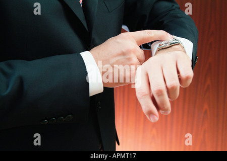 Businessman checking the time Stock Photo