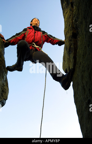 a female member of a mountain rescue team communicates with her radio ...