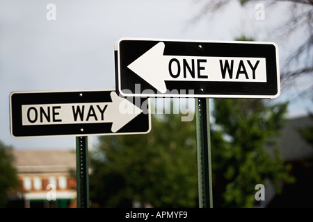 One way street sign pole in New York with red traffic light in the ...