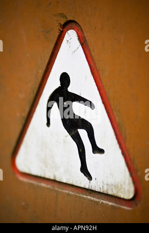 Cliff danger warning sign - with man falling over cliff, cliff edge ...