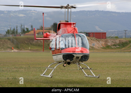 Helicopter hovering. Private Bell 206L1 LongRanger II helicopter (a derivative of the JetRanger) seen from ahead. Stock Photo