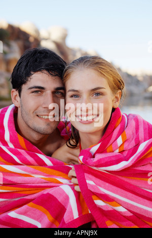 Young couple wrapped in a towel Stock Photo