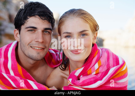 Young couple wrapped in a towel Stock Photo