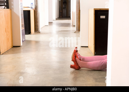 Body lying on office floor Stock Photo - Alamy