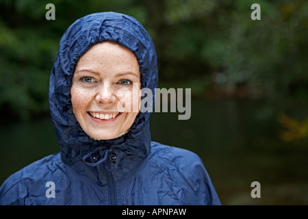 Mid Adult Woman Wearing Raincoat Stock Photo