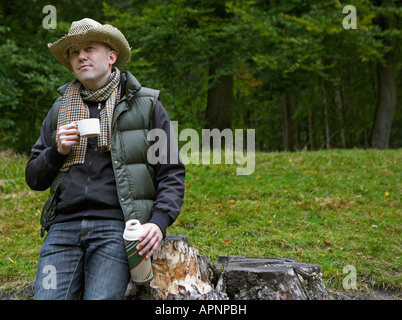 Man Drinking Coffee in Field Stock Photo