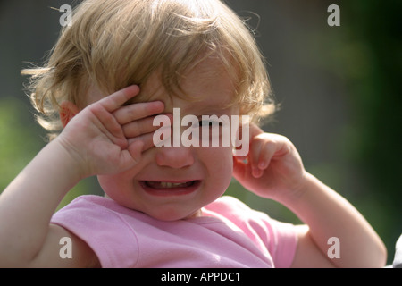 two year old little girl who is very unhappy Stock Photo