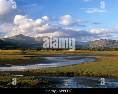 Afon Glaslyn River and Glaslyn marshes Site of Special Scientific Interest with Snowdonia National Park beyond Porthmadog Gwynedd Wales UK Stock Photo