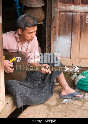 Burmese guitar player on Inle Lake in Myanmar Stock Photo - Alamy