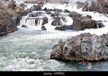 Kayakers navigating whitewater rapids at Great Falls, Potomac River, Virginia Stock Photo