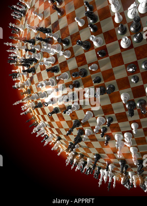 Chess pieces on a globe. Stock Photo