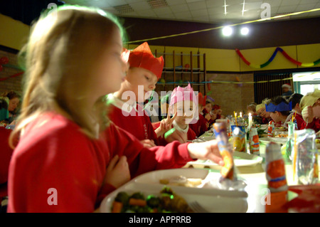 student pupil girls christmas dinner canteen lunch  school christmas english british education colour color horizontal inside ca Stock Photo