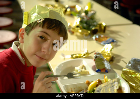 student pupil boy christmas dinner canteen lunch  school christmas english british education colour color horizontal inside cauc Stock Photo