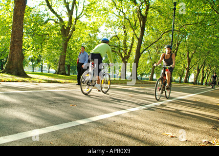 Cycling on Broad Walk in Hyde Park, London Stock Photo