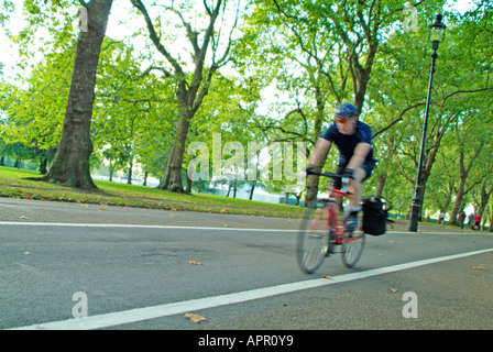 Cycling on 'Broad Walk' in Hyde Park, London Stock Photo