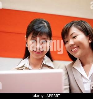 Two Businesswoman Looking at a Laptop Stock Photo