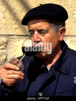 Rioja Man taste test sample glass wine tasting red beret have take drinker toper tippler Stock Photo