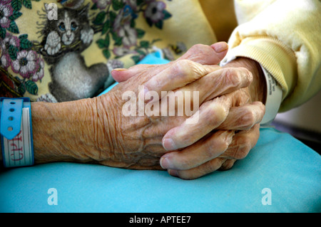 The hands of a senior female in a rehabilitation center in a nursing home 2 Stock Photo
