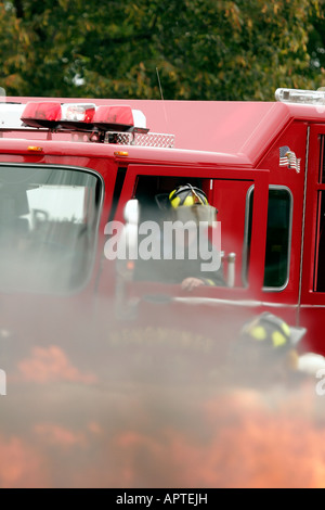 Two firefighters resonding to the scene of a car fire in Wisconsin Stock Photo