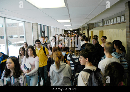 Crowds of high school students fill hallways during the exchanging of ...