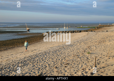 Walking on the beach at sunset Low tide on the Brewster flats Stock Photo