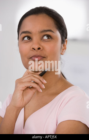Indian businesswoman thinking Stock Photo