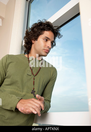 Hispanic man wearing rosary Stock Photo